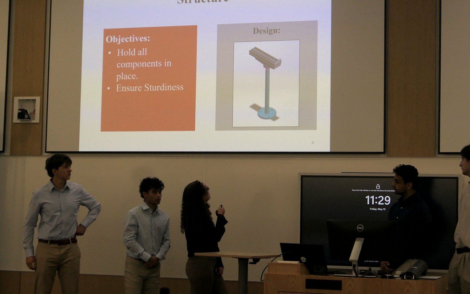Team members presenting the design to industry judges